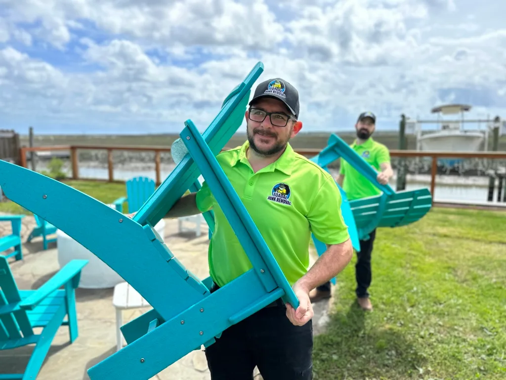 Toadal Junk Removal experts hauling away outdoor furniture